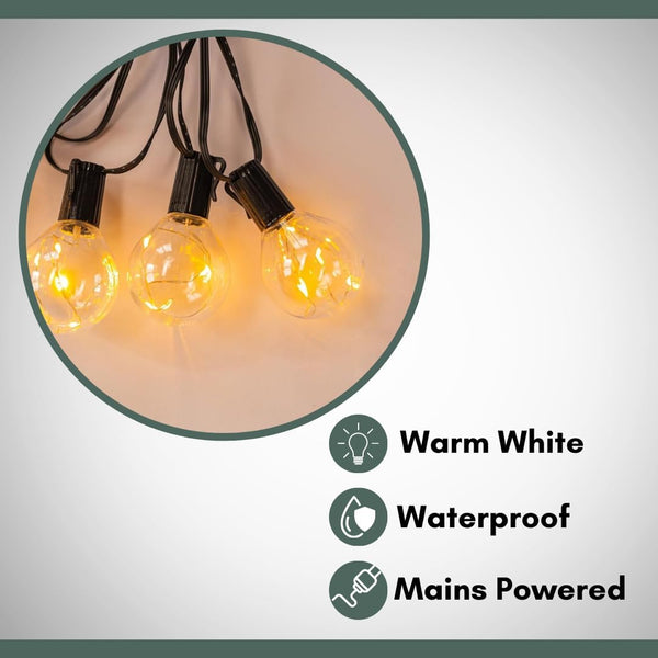 Weatherproof string lights illuminating a backyard.
