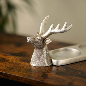 Decorative candle holder displayed on a mantelpiece