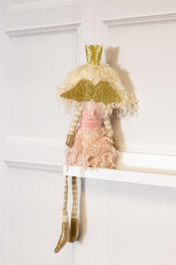 Pink fairy princess figure displayed on windowsill