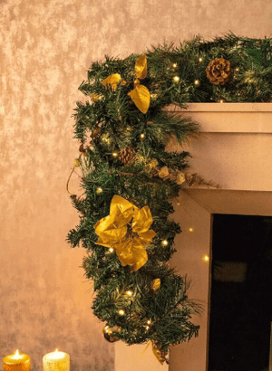 Illuminated festive garland with pinecones and berries