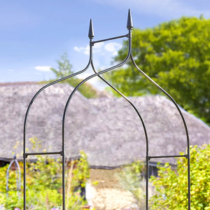 Garden arch supporting climbing roses
