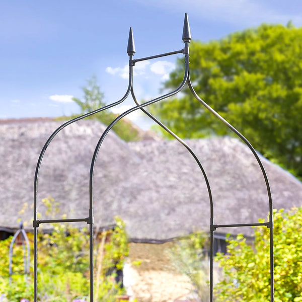Garden arch supporting climbing roses