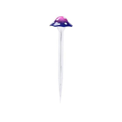 33cm purple mushroom light displayed in a flower bed