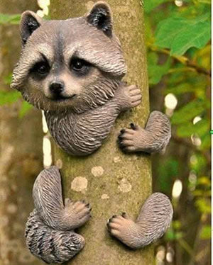 Peeking raccoon garden ornament