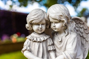 Illuminated angel reading figurine