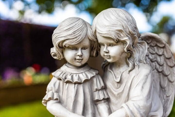 Illuminated angel reading figurine
