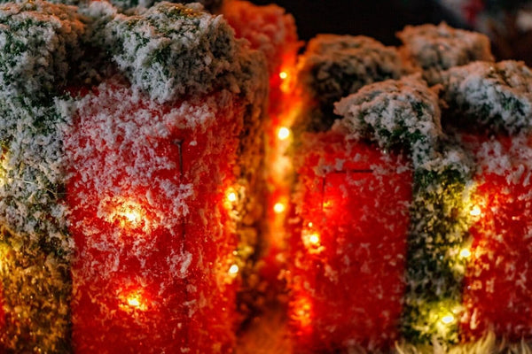 Three illuminated Christmas present boxes with sparkling frosted finish