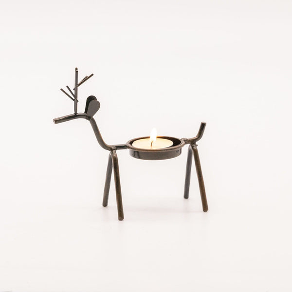 Metal and resin reindeer candle holders displayed indoors