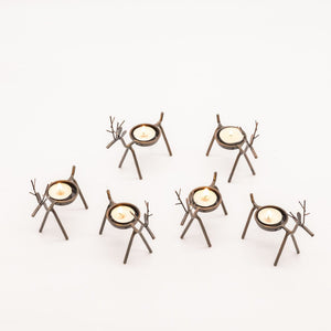 Rustic reindeer candle holders creating a festive display
