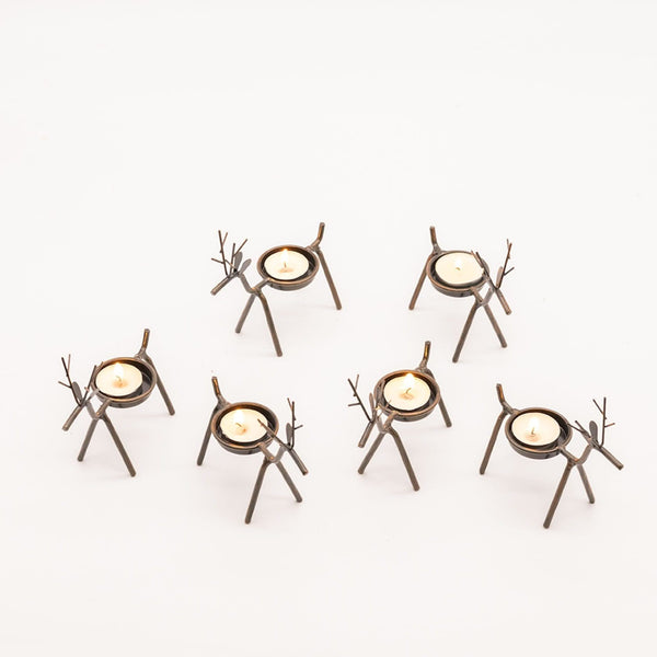 Rustic reindeer candle holders creating a festive display