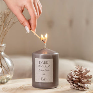 Premium scented pillar candle with cotton wick.