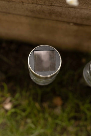 Four solar stake lights displayed outdoors