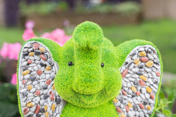 Artificial grass elephant displayed on lawn