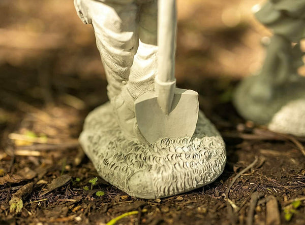 Grey stone effect boy and girl statues