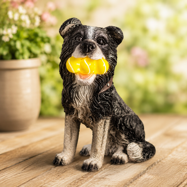 Light up tennis ball dog ornament displayed on lawn