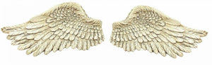 Pair of resin angel wings displayed as home decor