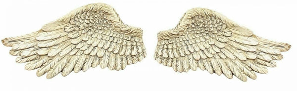 Pair of resin angel wings displayed as home decor