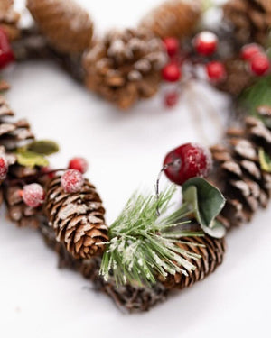Pinecone and berry winter wreath for seasonal decorating