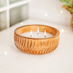 Wooden scented candle arranged with cosy fall decorations