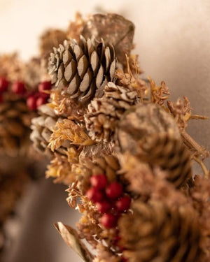 Festive red berry wreath styled for the Christmas season
