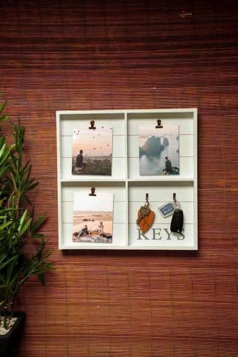 White wall hanging organiser with photo clips