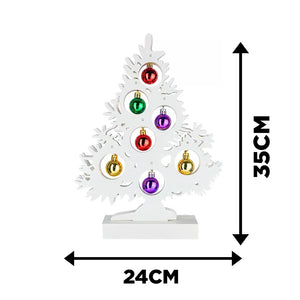 Rustic wooden Christmas tree displayed on mantelpiece