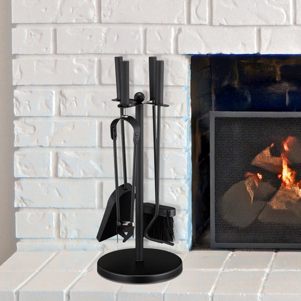 Black fireplace tool set in front of a lit fireplace with white brick wall background