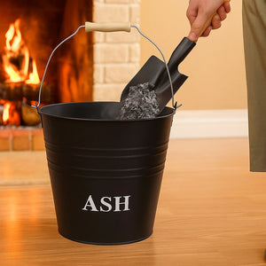 Black 'ASH' bucket with a shovel against a warm-toned background