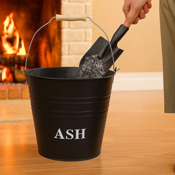 Black 'ASH' bucket with a shovel against a warm-toned background