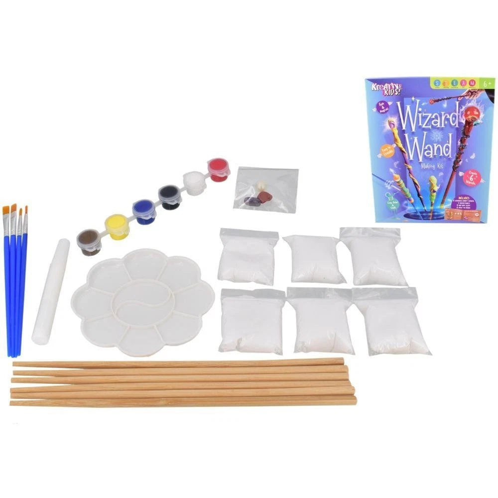 Child painting Wizard Wand toys with a Christmas scene in the background