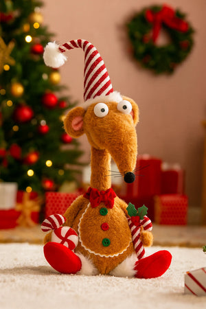 Plush toy mouse in a Christmas hat with a decorated tree and wreath in the background