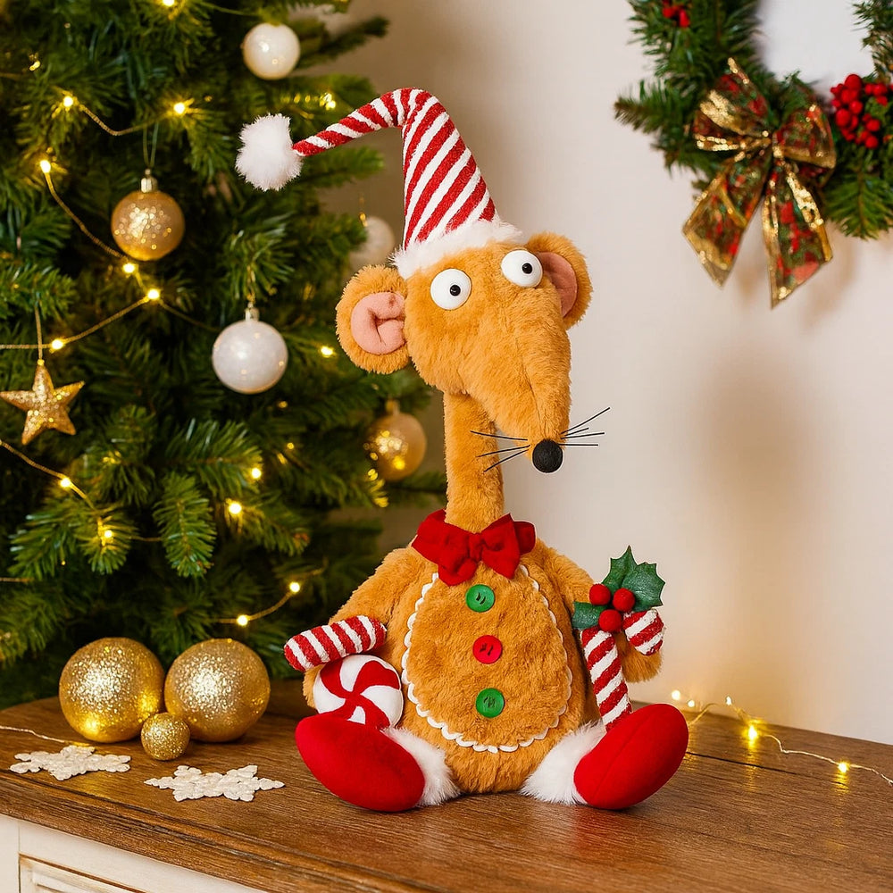 Plush toy mouse in a Christmas outfit with a decorated tree in the background