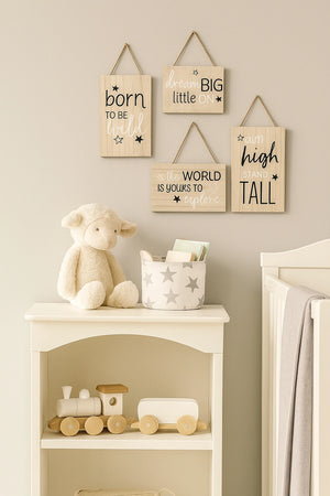 Nursery room with teddy bear, shelf, and motivational signs on the wall.
