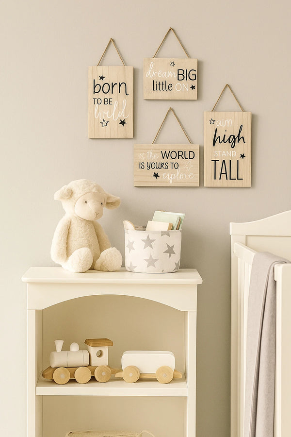 Nursery room with teddy bear, shelf, and motivational signs on the wall.