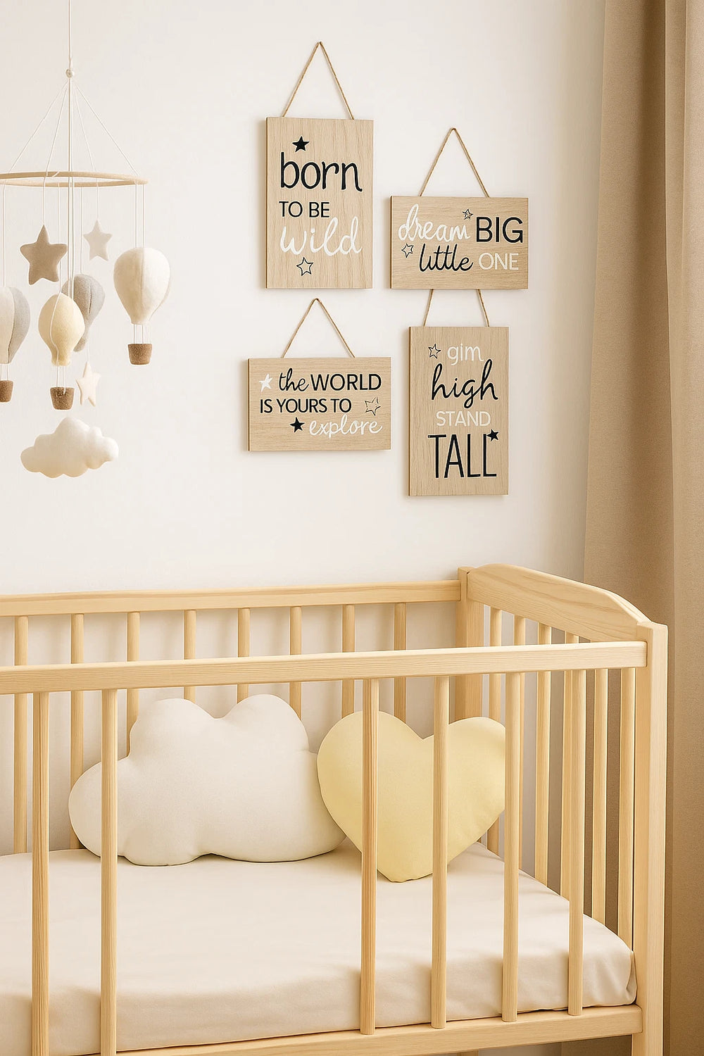 Nursery room with wooden crib, cloud-shaped pillows, and motivational signs on the wall.