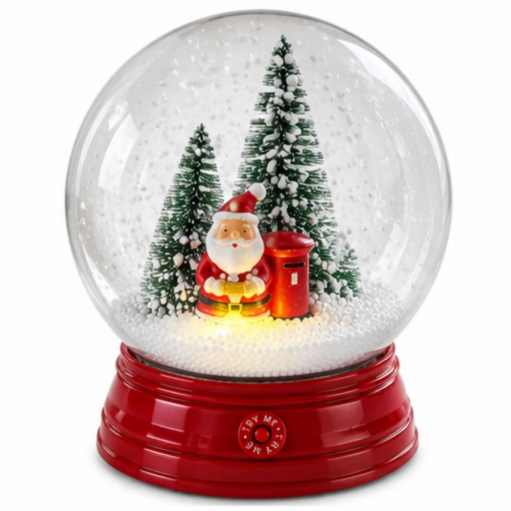 A festive Christmas snow globe with a glowing red base, featuring Santa Claus, miniature trees, and a red mailbox inside a clear globe on a wooden table with warm holiday lights in the background.