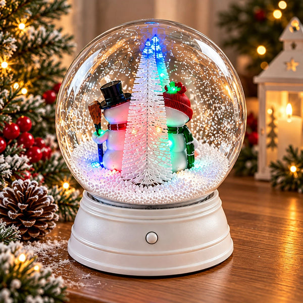 Rear view of snowman snow globe with illuminated snowy Christmas tree.