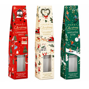 Three Christmas-themed fragranced diffuser boxes standing upright on a white background: red Cinnamon Spice, cream Sugared Vanilla, and green Mistletoe & Fir.
