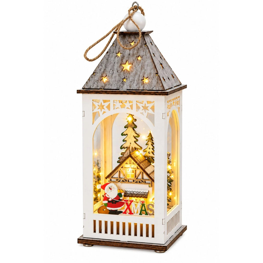 Light up Christmas lantern with Santa, cottage and festive greenery display.