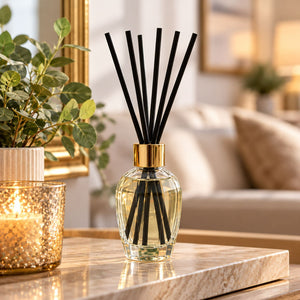 300ml Cinnamon Spice reed diffuser with black reeds and gold detailing.