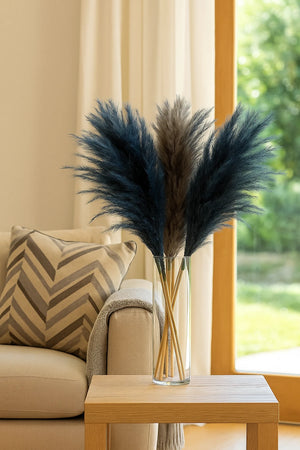 Decorative vase with pampas grass on a table in a living room setting