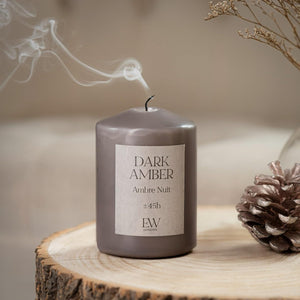 Small pillar candle suitable for gifting and home décor.