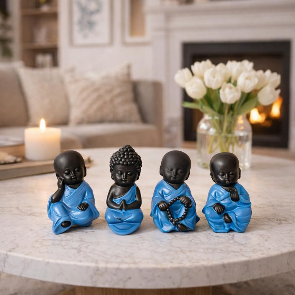 Set of four blue resin Buddha ornaments