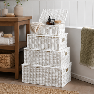 Set of four white wicker storage baskets