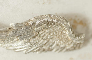 Shabby chic resin wings decorating a hallway