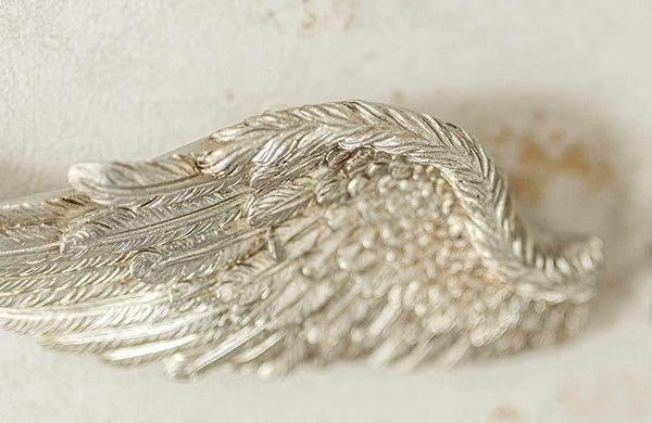 Shabby chic resin wings decorating a hallway