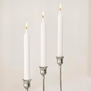 Silver metal candlestick holder set displayed together