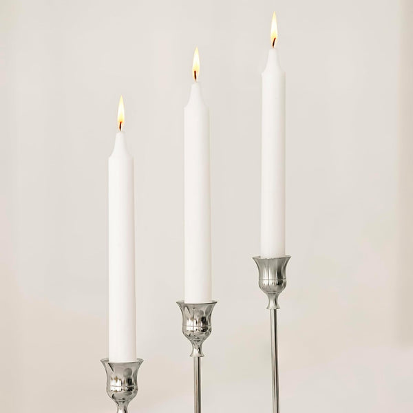 Silver metal candlestick holder set displayed together
