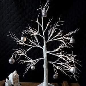 Decorative silver twig tree illuminated with warm white LEDs