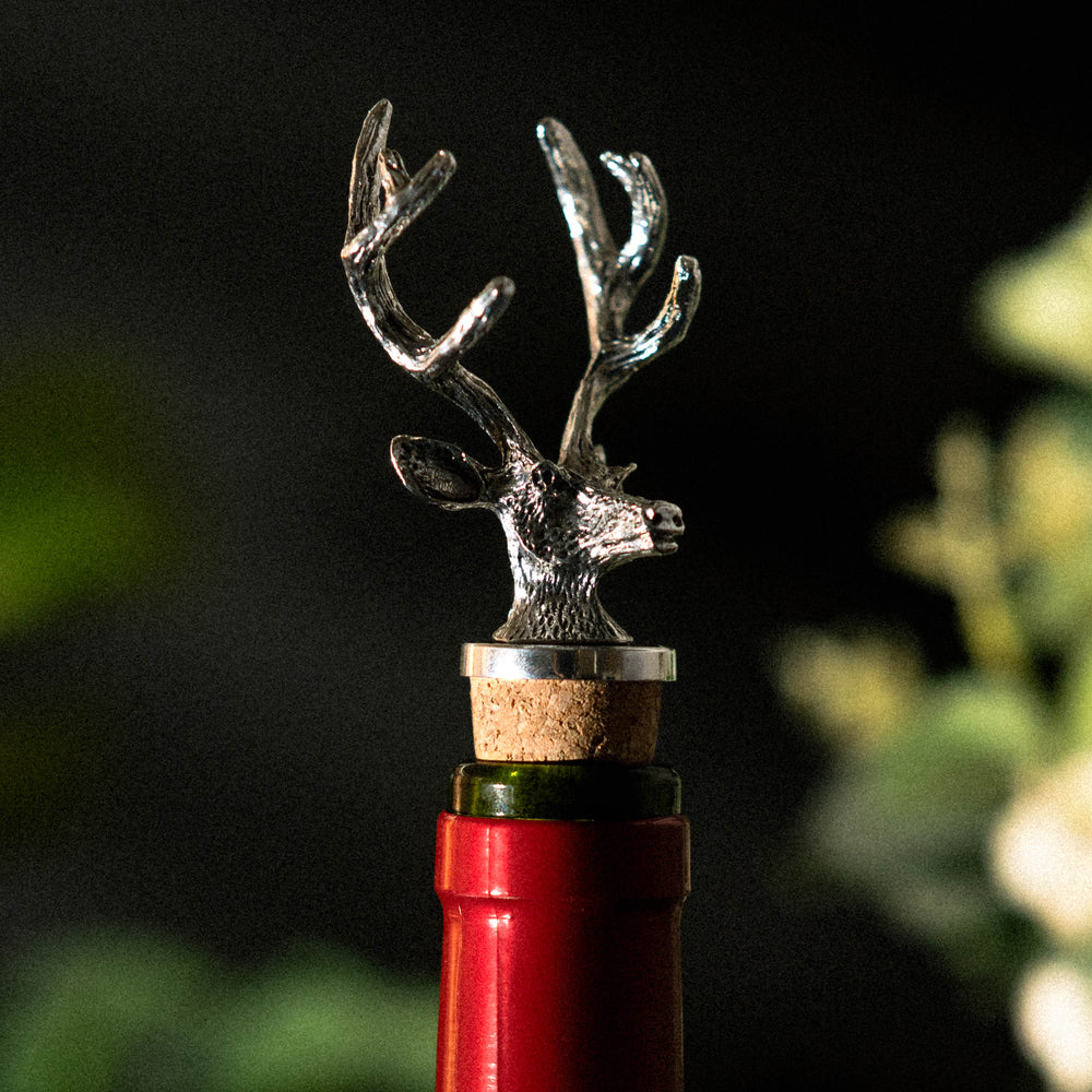 Three silver stag cork bottle stoppers